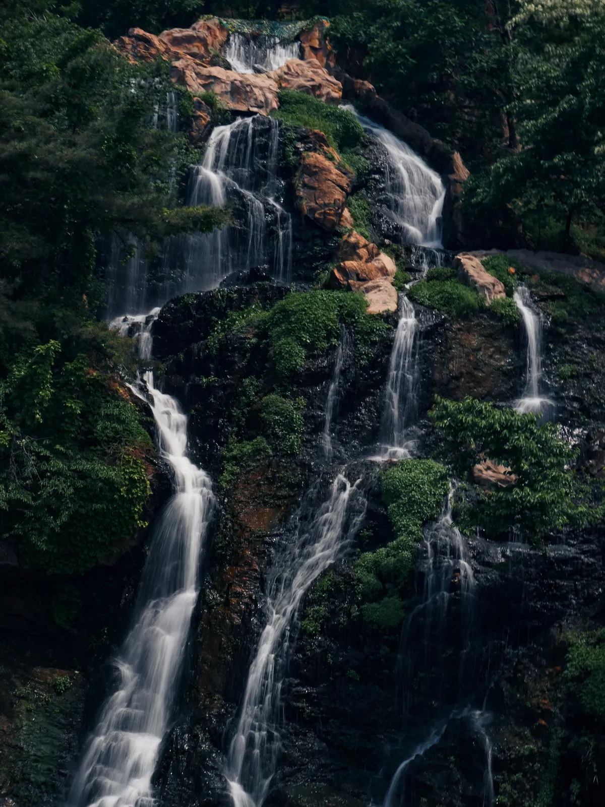 Long exposure shot of a multiple waterfalls from an iconic cafe, Cafe Pokpo in Seoul, South Korea